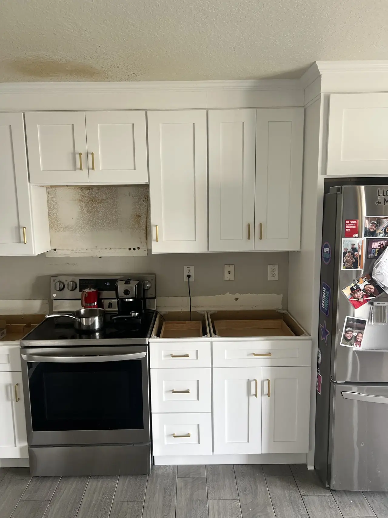 White kitchen cabinets around the range finished for a Brandon FL home